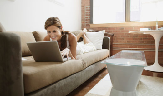 Young adult woman using laptop computer